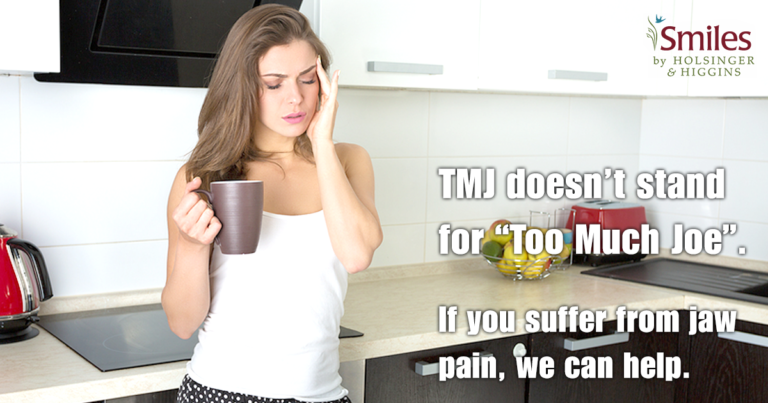 woman drinking coffee in kitchen with a headache